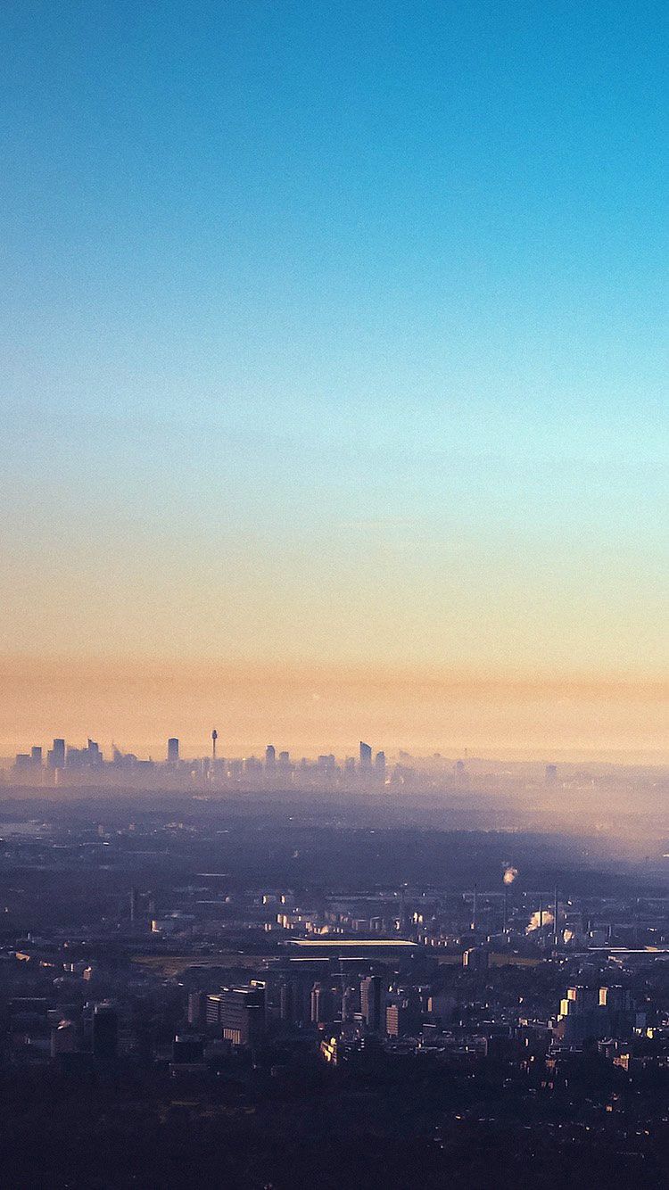 750x1334 Clear Blue Sky Morning Mist Over City Metropolis iPhone 6 Wallpaper