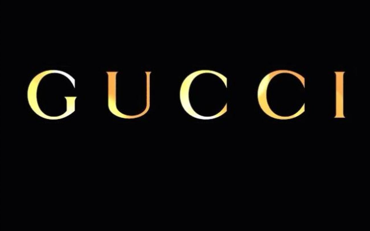 Download Golden Gucci Logo Over Supreme Logo Wallpaper