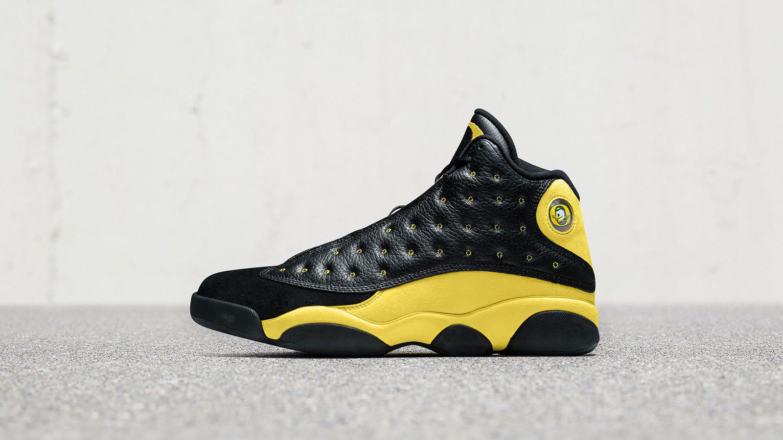 black and yellow 13 jordans