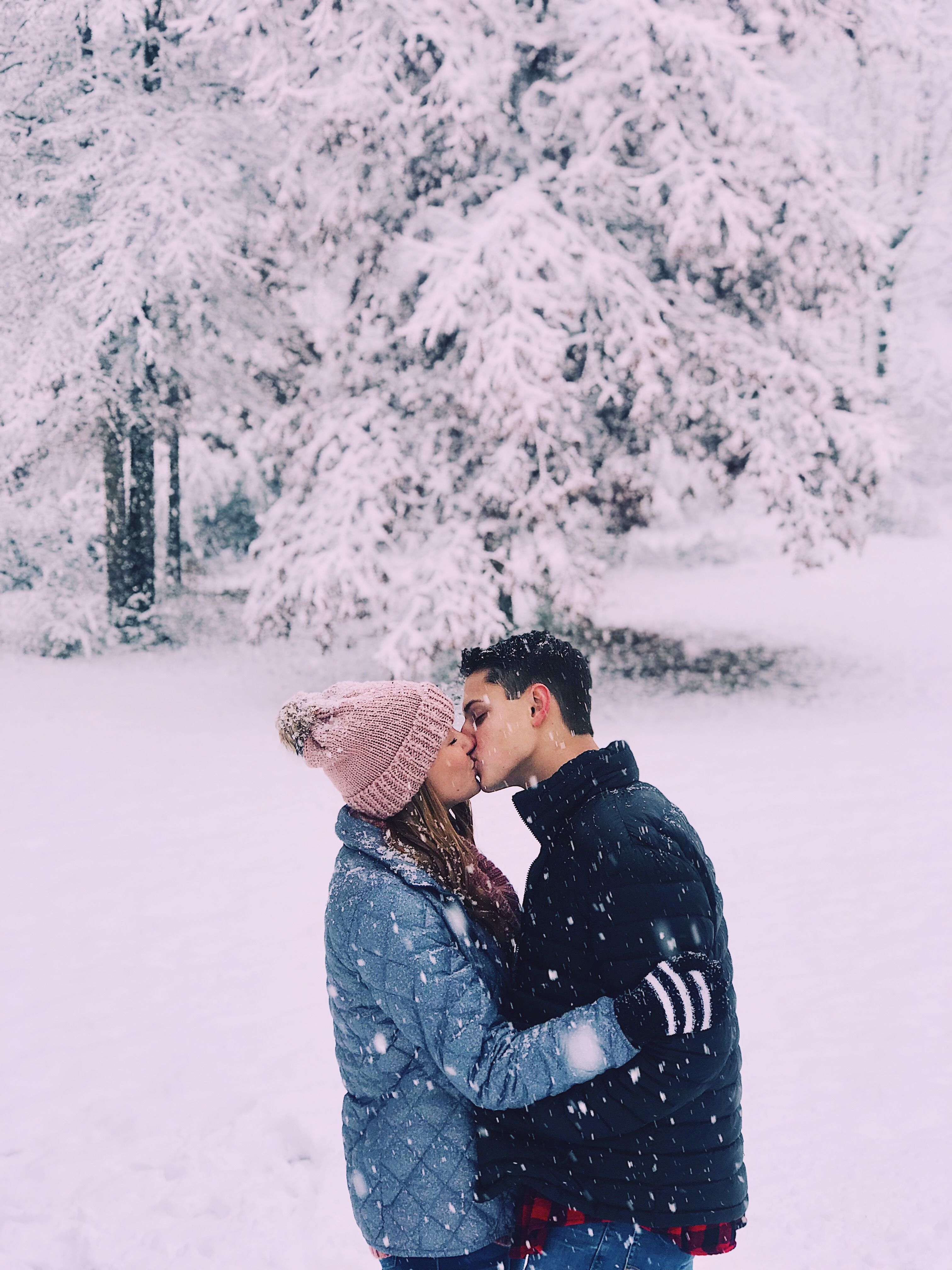 A tourist couple poses for a photograph with snowball after heavy snowfall  in upper reaches of world-famous ski resort of Gulmarg, on Monday. —  Excelsior/Amin War - Daily Excelsior