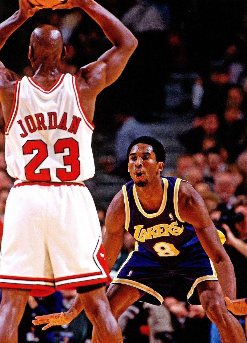 Download Kobe Bryant competing with Michael Jordan Wallpaper