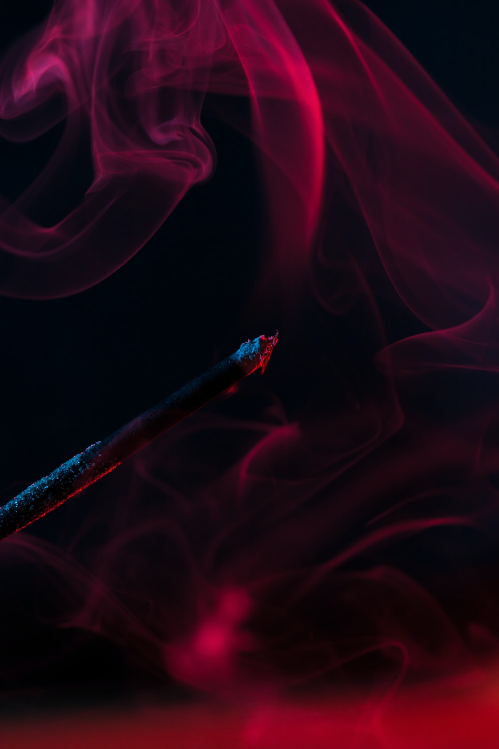 Premium Photo  Red smoke abstract on black background fire design