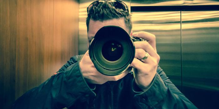 3873x2331 Man In Black Jacket Holding Black Dslr Camera - Free Stock Photo