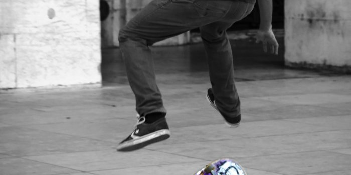 2214x3264 man jumps with skateboard in selective color photography free image