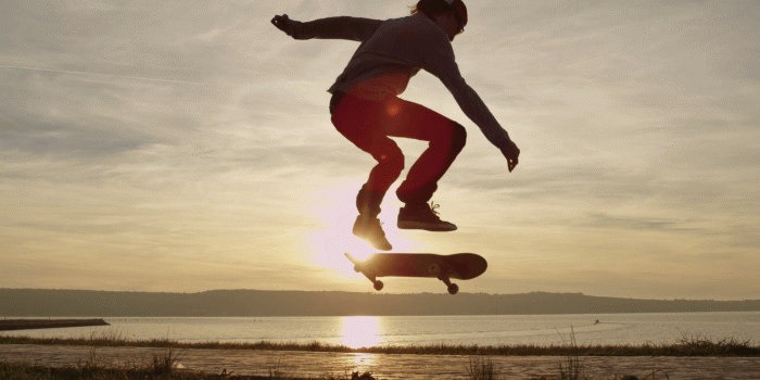 1920x1080 SLOW MOTION Skateboarder skating and jumping kickflip trick over the  setting sun Stock Video Footage - Storyblocks Video