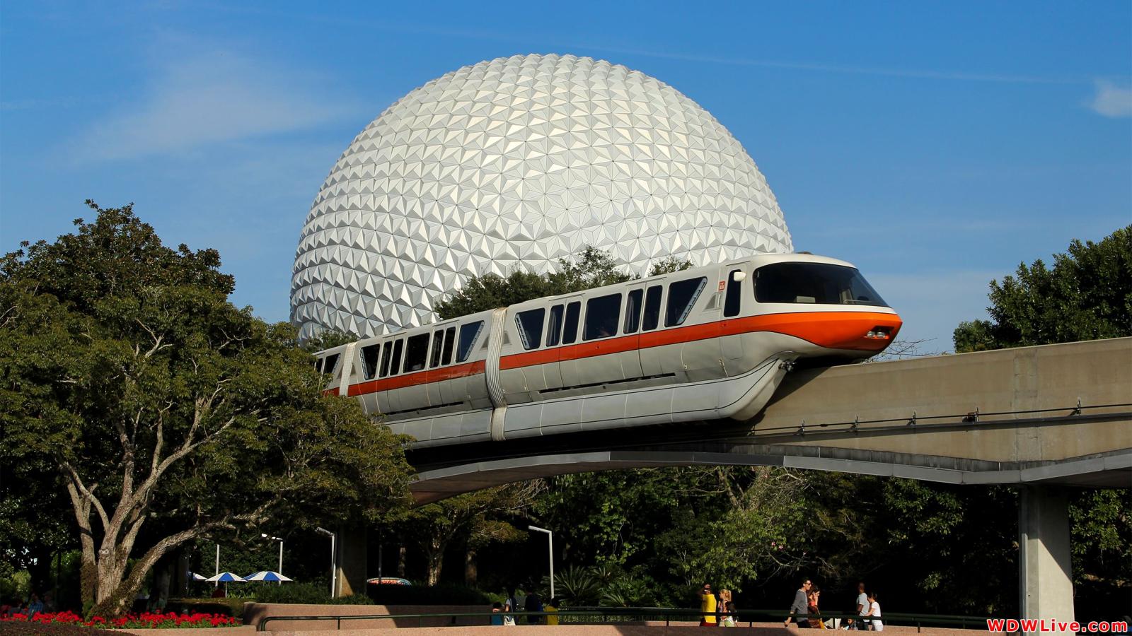 2560x1440 Monorail: Orange Monorail rolling through Future World with