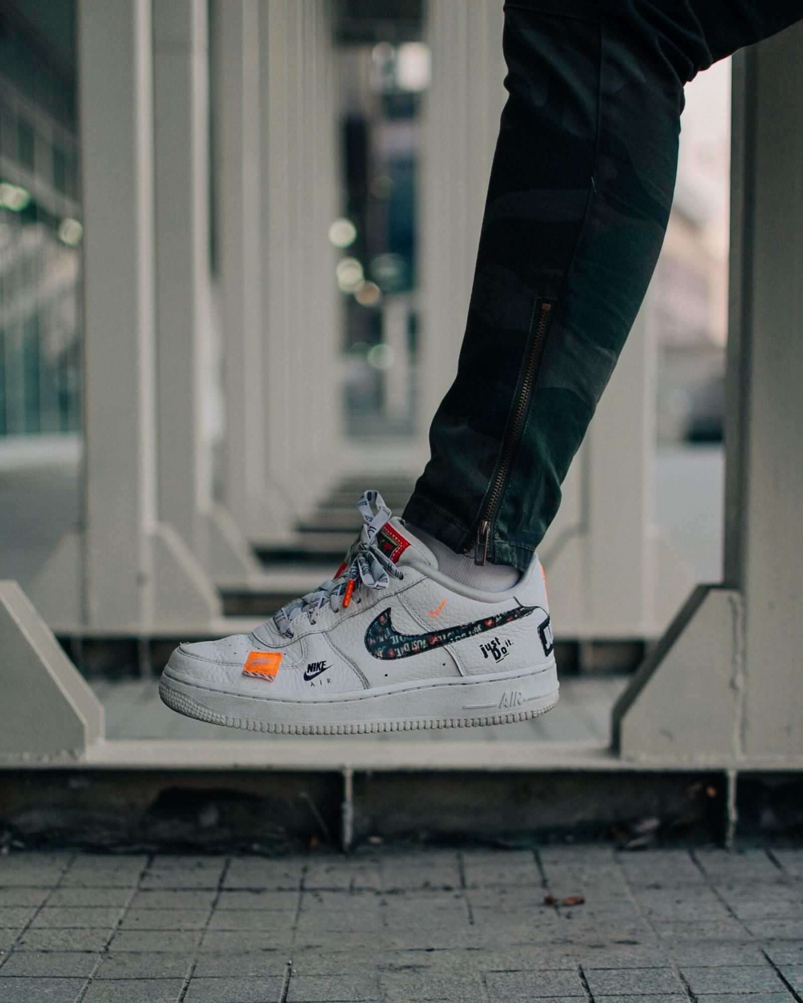 1875x2344 Selective Focus Photography Of Person Wearing Nike Air Force 1 Low