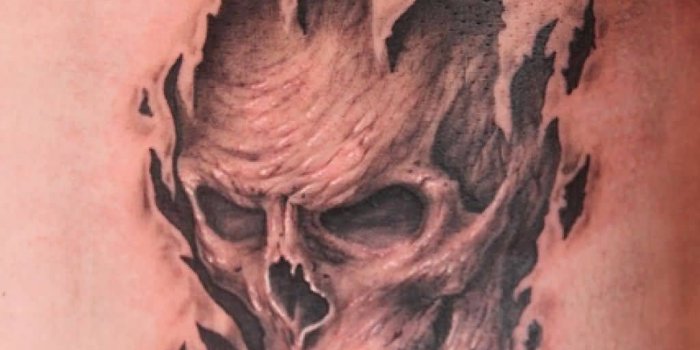 1024x1534 Lovely 3D Tattoo Of Skull And Rip Skin | Golfian.com