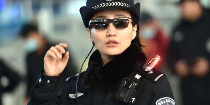 4500x3054 Police officers in futuristic city wallpaper