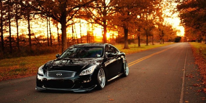 1130x706 Beautiful Infinity black car on the road - Autumn season
