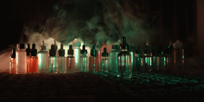 1920x1080 Vape concept. Slider shot. Smoke clouds and vape liquid bottles on dark  background. Light effects. Useful as background or vape advertisement.