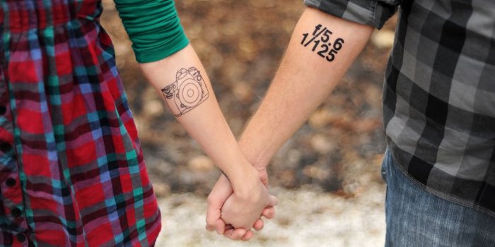 1366x768 Download wallpaper 1366x768 hands, tattoos, couple, love, tattoo