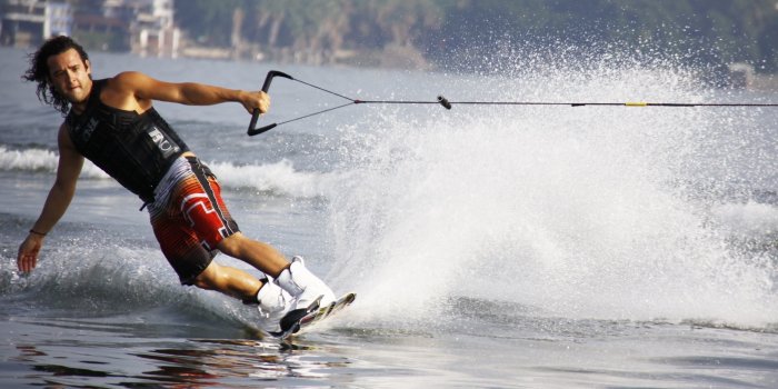 3076x1880 Man in Black Tank Top and Red Shorts Waveboarding · Free Stock Photo