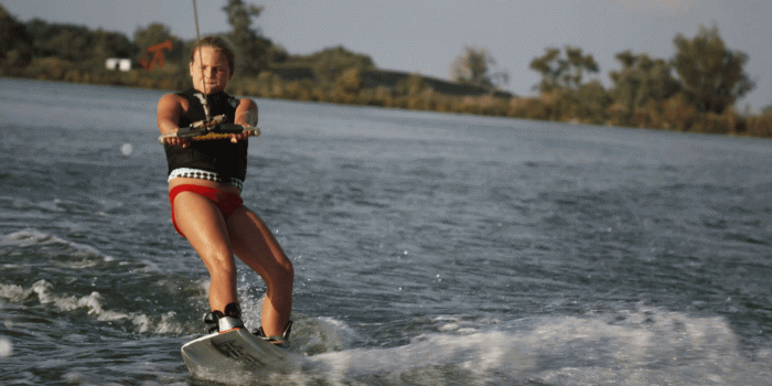 1920x1080 girl on a wakeboard behind a boat Stock Video Footage - Storyblocks Video