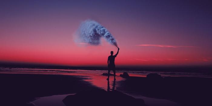 1366x768 Download wallpaper 1366x768 smoke bombs, smoke flare, shore, sunset