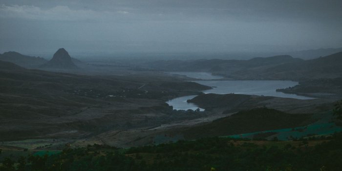 1366x768 Download wallpaper 1366x768 river, fog, aerial view, armenia tablet