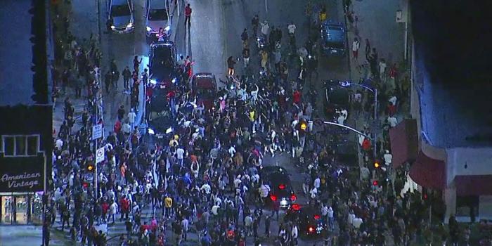 1600x900 Large crowd gets rowdy during memorial for XXXTentacion