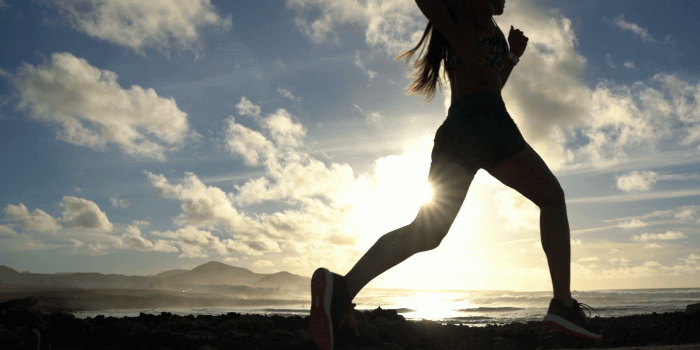 1920x1080 Running silhouette of woman runner working out at beach sunset.  Unrecognizable female athlete in sport workout run outside. Fit fitness  girl. Stock