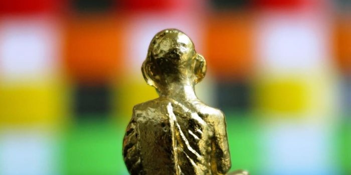 910x1365 HD wallpaper: Back view of a golden Buddha statue isolated against a