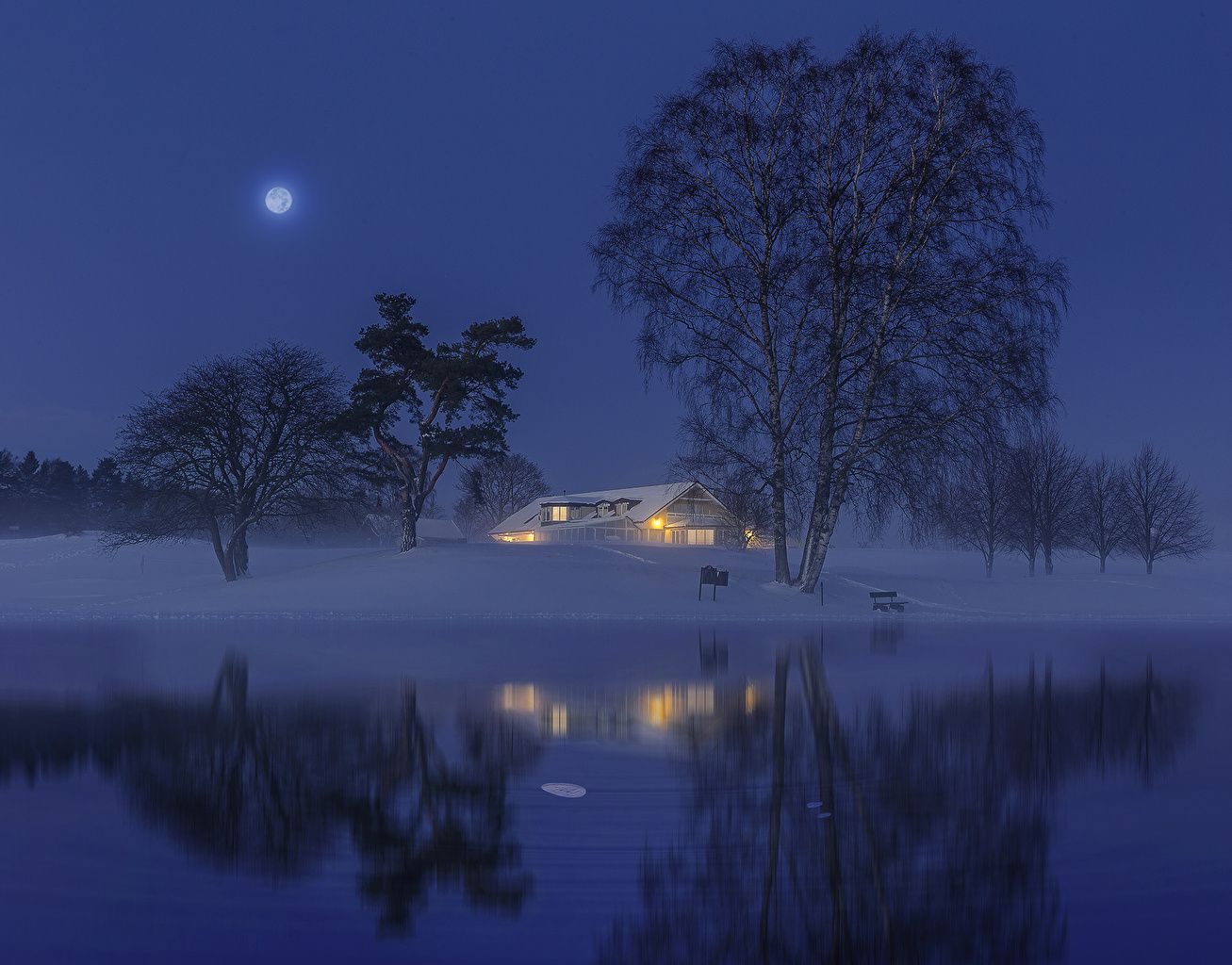 1307x1024 Wallpaper Sweden Nature Winter Moon Snow Night river Trees Building