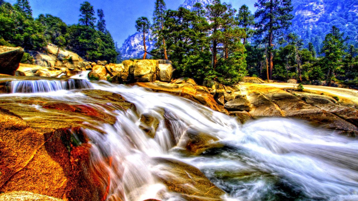 1366x768 Rocks Nature Breakwater Water Waterfalls Moving Waterfall Wallpaper