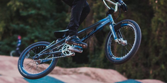 1350x2400 Download wallpaper 1350x2400 cyclist, stunt, jump, helmet, cycle