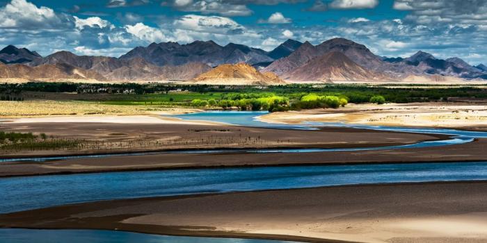 1280x800 Download wallpaper 1280x800 china, tibet, mountains, oasis, river