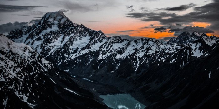 1366x768 Download wallpaper 1366x768 mountains, lake, tops, top view tablet