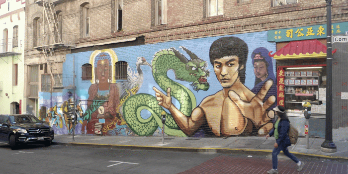 1920x1080 a woman walks past and admires a painted mural of bruce lee in china town,  san francisco Stock Video Footage - Storyblocks Video