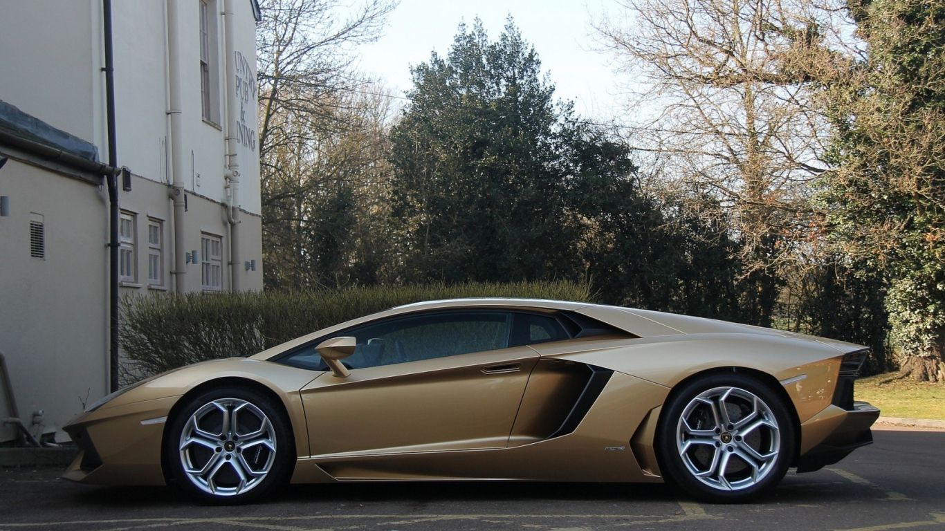 1366x768 HD Background Lamborghini aventador LP 700-4 Dark Gold Color Lawn