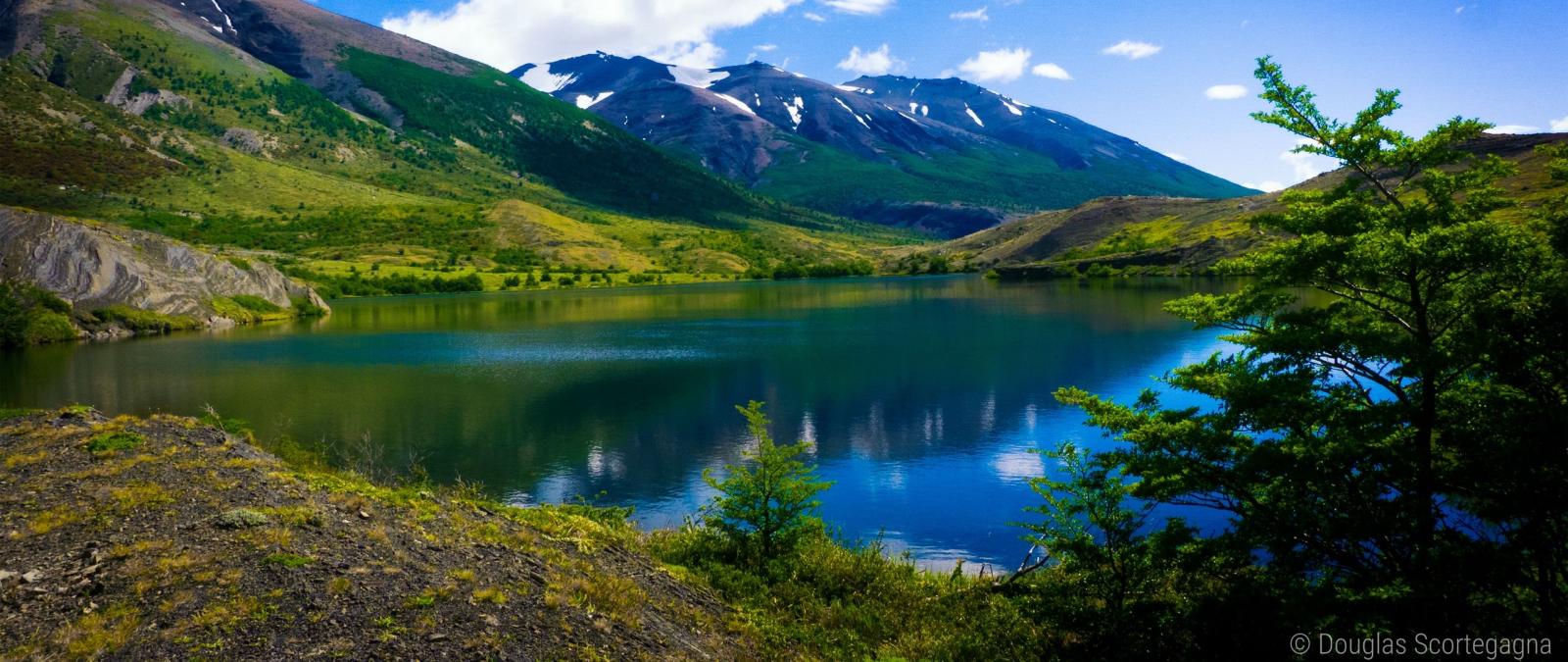 2560x1080 Download wallpaper 2560x1080 mountains, lake, grass, sky, summer