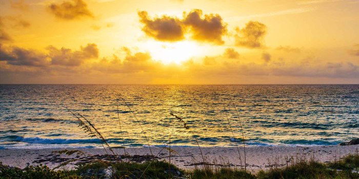 2048x1280 Caribbean Wallpaper: Sunrise Over Teeny-Tiny Staniel Cay | Bahamas