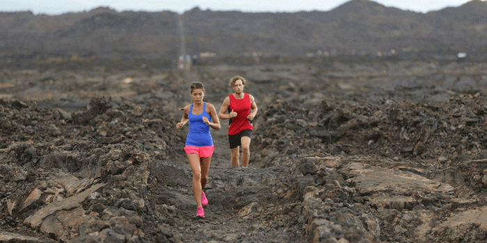 1920x1080 Runner man and woman running in trail run in dramatic nature training for  marathon or triathlon. Fit young fitness model man and asian woman training 