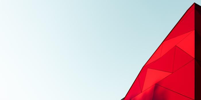 3840x2560 a light blue sky with a bright red triangular top of a building just