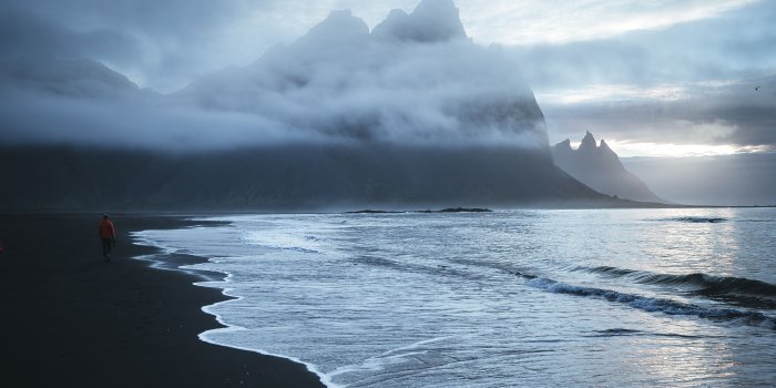 4480x6720 Lonely Sea Beach Wave Sand Black Man Mountains Clouds - Free Stock