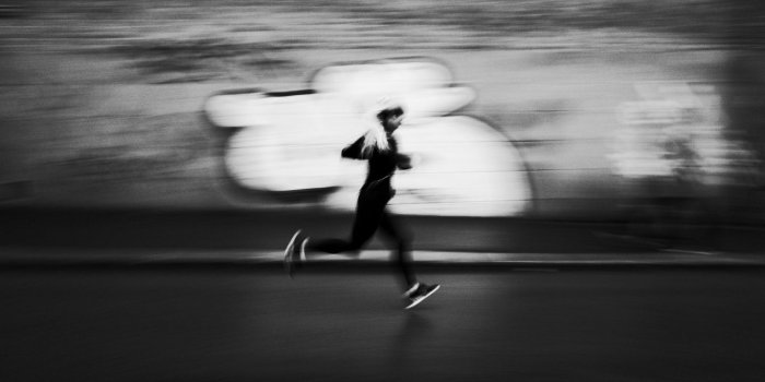 1366x768 Download wallpaper 1366x768 running, bw, athlete, outlines, speed