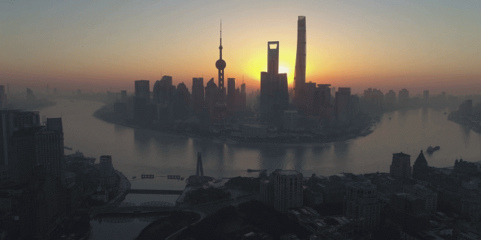 1920x1080 Shanghai Skyline in the Sunny Morning. Lujiazui District and Huangpu River.  China. High Altitude Aerial View. Drone is Flying Upward and Sideways.