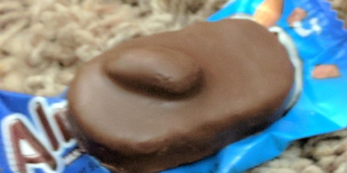 1024x768 An almond joy with a giant nut sticking out the bottom