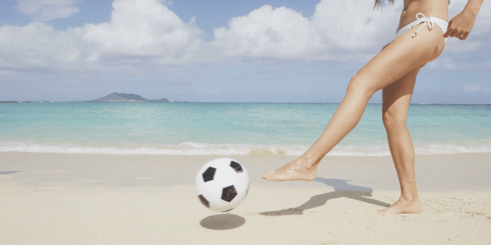 1920x1080 Beach couple having fun on playing soccer football with ball living healthy  active lifestyle during summer travel vacation holidays on beautiful