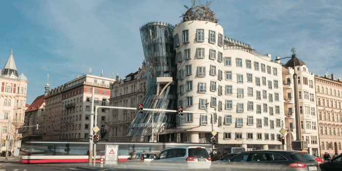 1920x1080 The Dancing house of Prague, also known as Fred and Ginger, made of glass,  located on the picturesque embankment of the Vltava river, with a busy