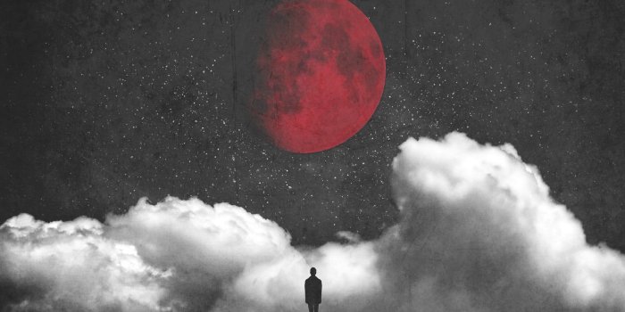 2048x1365 Silhouette of man standing under red full moon overlooking clouds