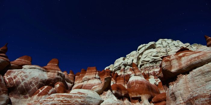 2560x1600 Rusty peaks rising towards the beautiful blue sky wallpaper - Nature