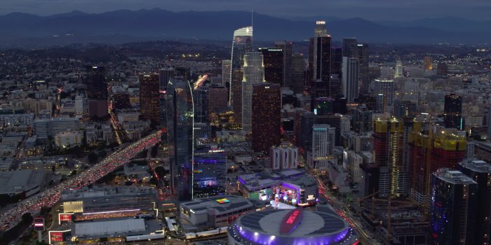 1920x1080 8K stock footage aerial video orbiting Downtown Los Angeles skyscrapers,  Interstate 110 and Staples Center at twilight, California Aerial Stock