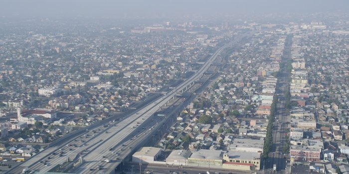 1920x1080 5K stock footage aerial video of Interstate 110 with traffic, tilt to  reveal neighborhoods, South Central Los Angeles Aerial Stock Footage  AX0017_039
