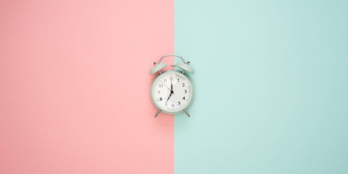 1366x768 Download wallpaper 1366x768 alarm clock, minimalism, pink, pastel