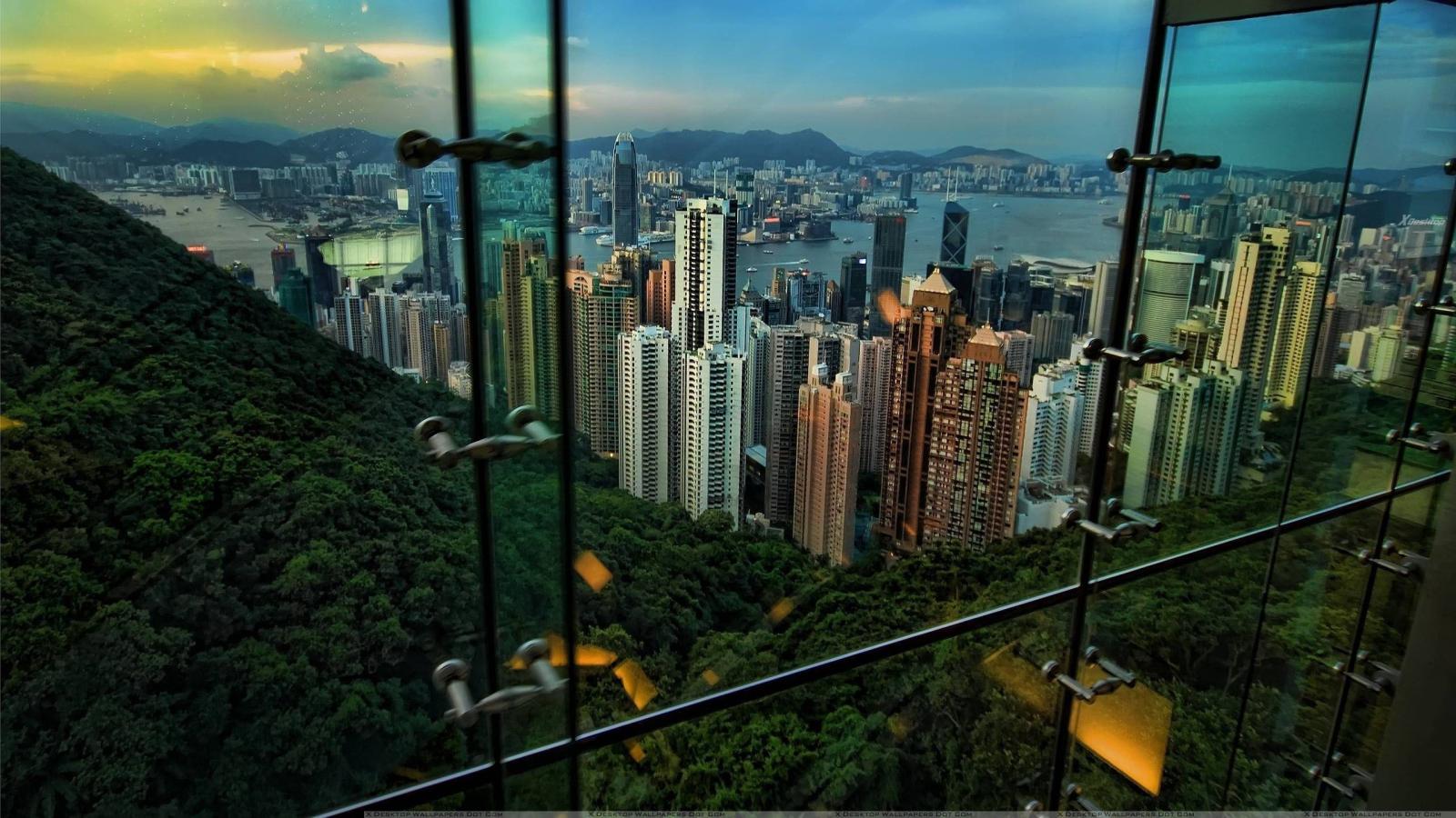 2560x1440 Superb View Of Hong Kong City Through The Window Wallpaper