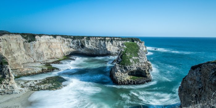 6748x2723 Sea with waves near cliff under blue sky during daytime, santa cruz