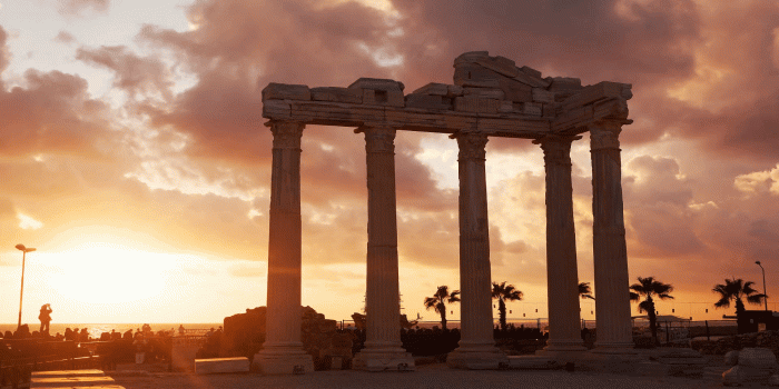 1920x1080 Ancient ruins of Roman Empire ( construction date about II century) against  the sunset. Apollo Temple, Side, Turkey. Time Lapse. Stock Video Footage - 