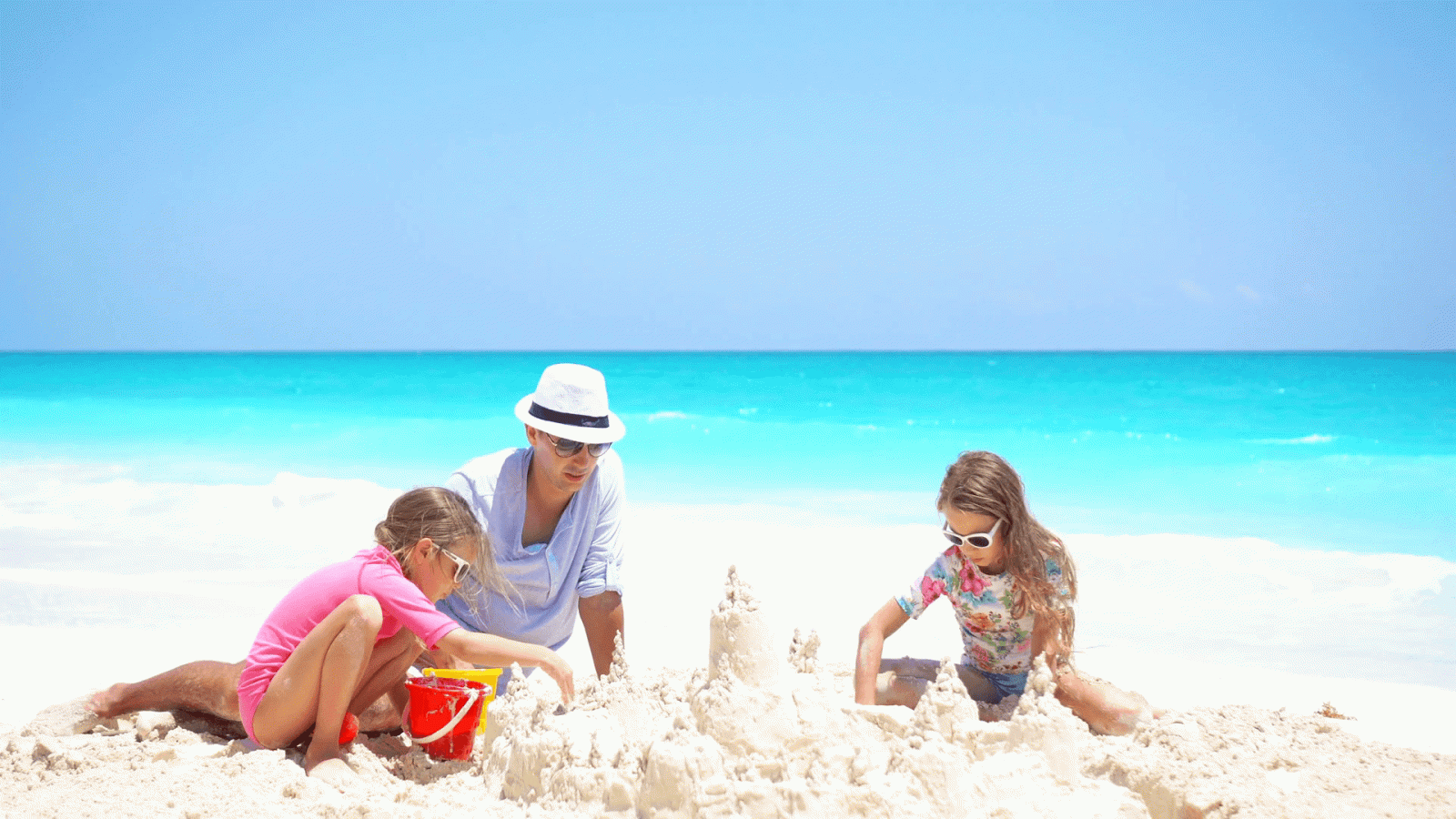 1920x1080 Father and little kids making sand castle at tropical beach Stock Video  Footage - Storyblocks Video