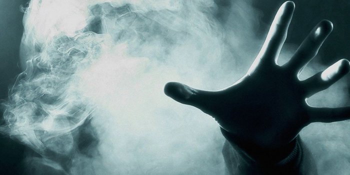 1125x2436 af34-hand-from-smoke-green-dark - Papers.co